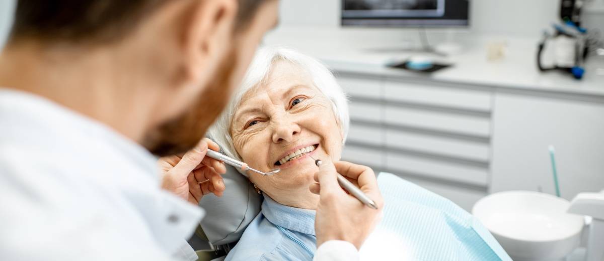 Elderly woman during the medical examination with dentist