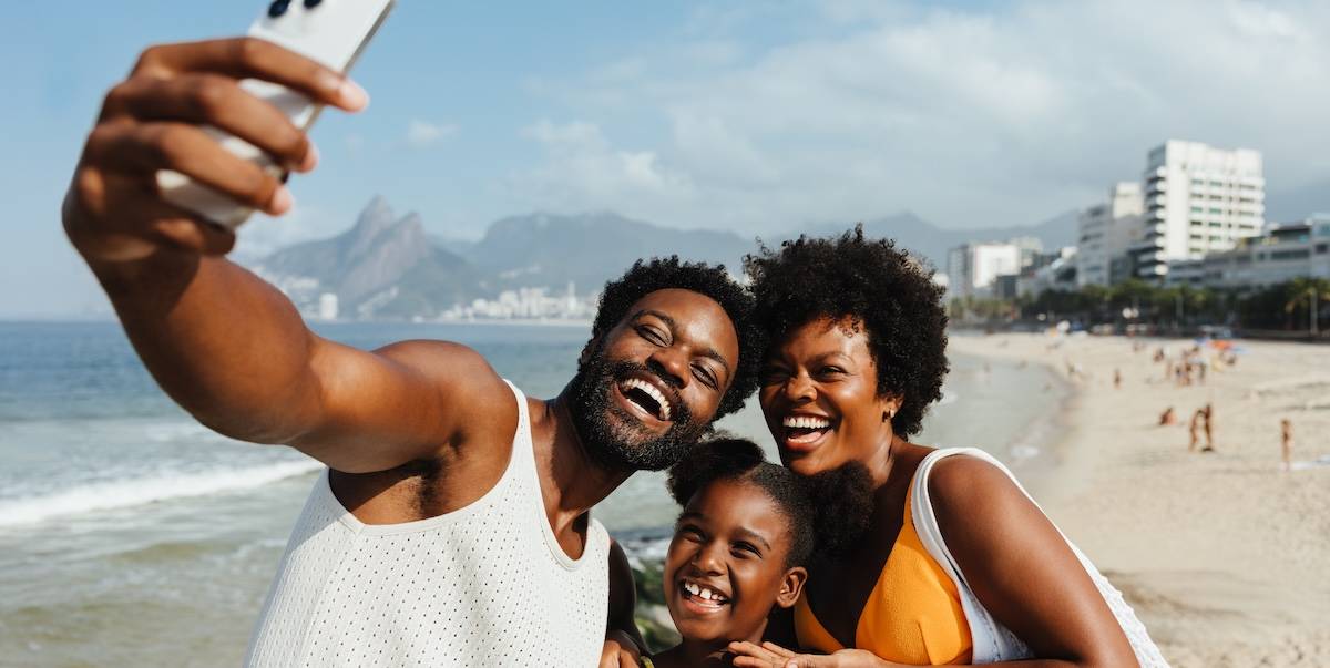 Brazilian family taking a joyful selfie in Rio de Janeiro