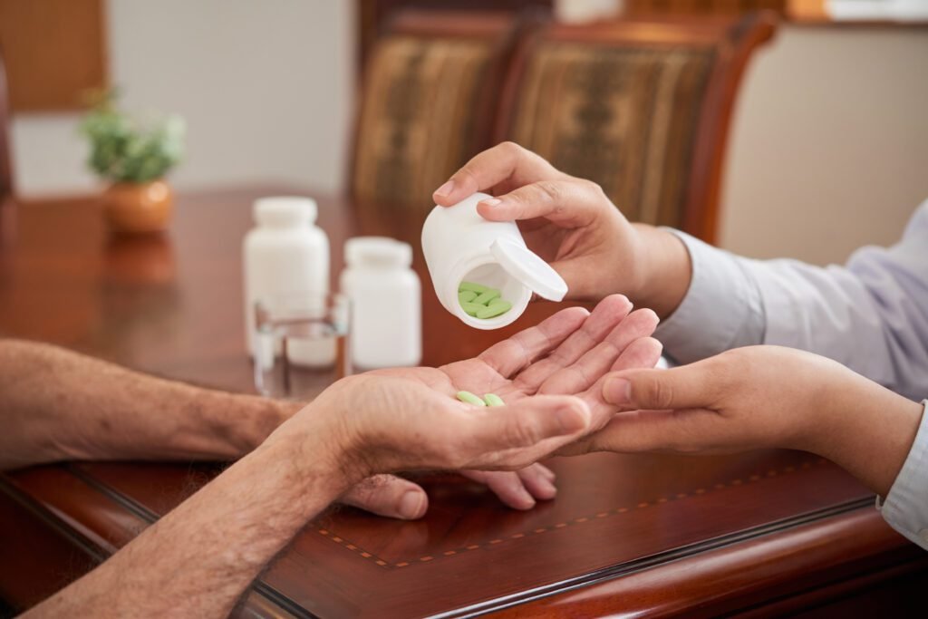 Medicare Advantage vs Medicare Supplement: Which Plan Is Right for You in Fort Collins, CO | Aspen Financial & Insurance in Fort Collins, CO | Annuities in CO | Life insurance in CO Doctor pouring pills into the hand of a patient during a home visit.