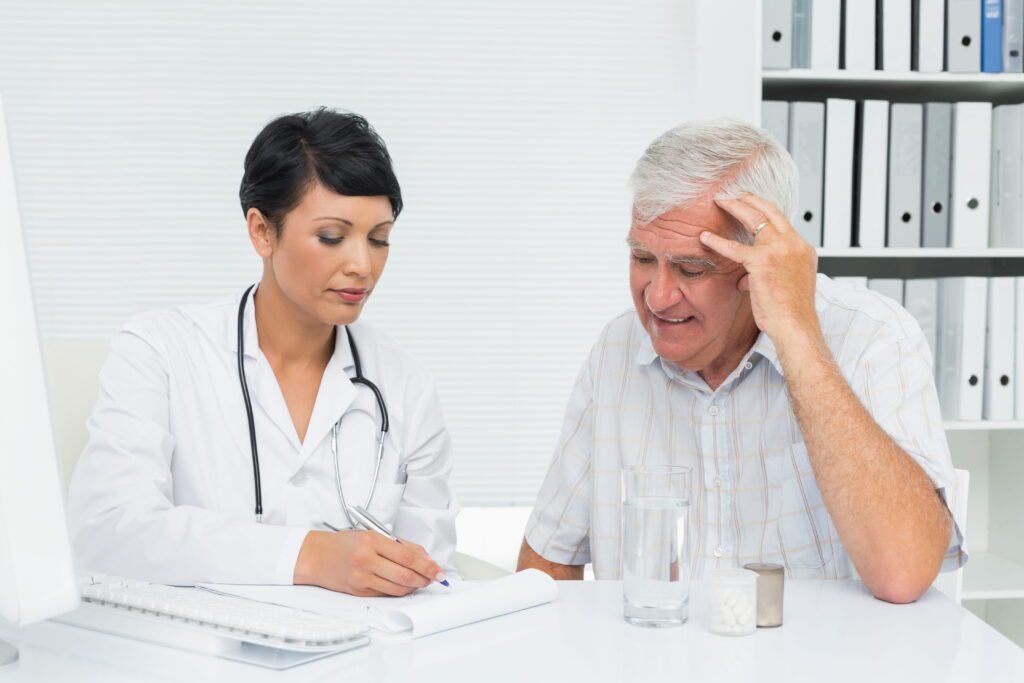 Common Medicare Enrollment Mistakes and How to Avoid Them | Aspen Financial & Insurance in Fort Collins, CO | Annuities in CO | Life insurance in CO Female doctor reviewing medical reports with a male patient during a consultation.
